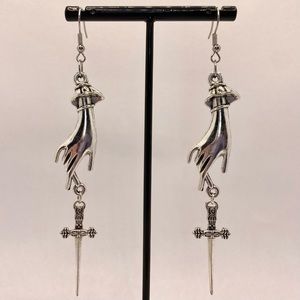 Victorian hand with thin dagger earrings silver tone